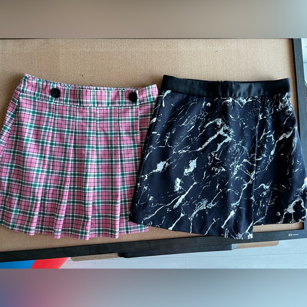 2 skirts for $15. Plaid Pink and Black Marble Skirt Set